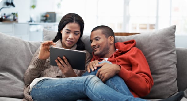 couple using device on couch